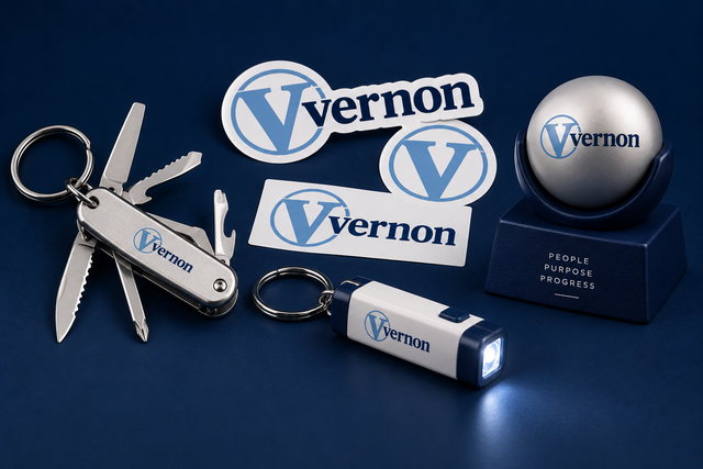 A branded multi-tool, stickers, flashlight keychain, and desk award